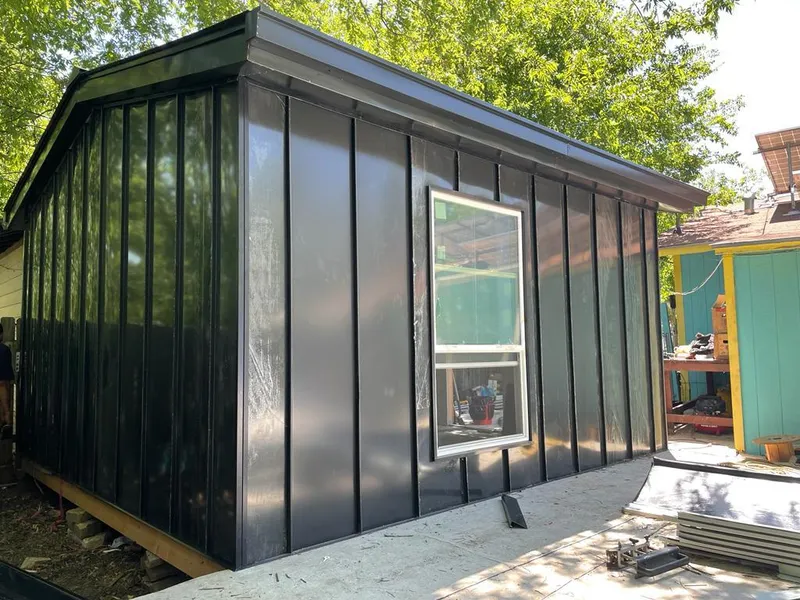 Black standing seam metal wall panels for Metal Roof Installation in Plattsburgh