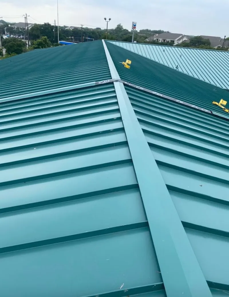 Green commercial metal roof ridge and valley for Metal Roof Repair in Plattsburgh